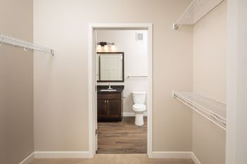 a bathroom with a toilet and a sinkat The Carver Apartments, Chaska, 55318