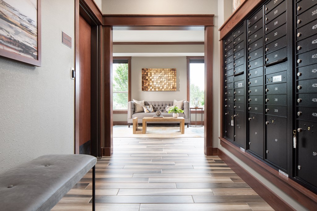 a hallway with mailboxes leading to a common area  at Victoria Park and V2 Apartments, St. Paul, MN