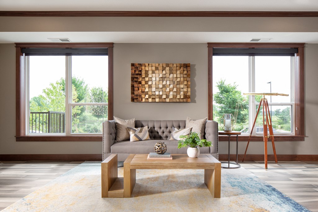 a common area with a sofa and coffee table  at Victoria Park and V2 Apartments, St. Paul, Minnesota