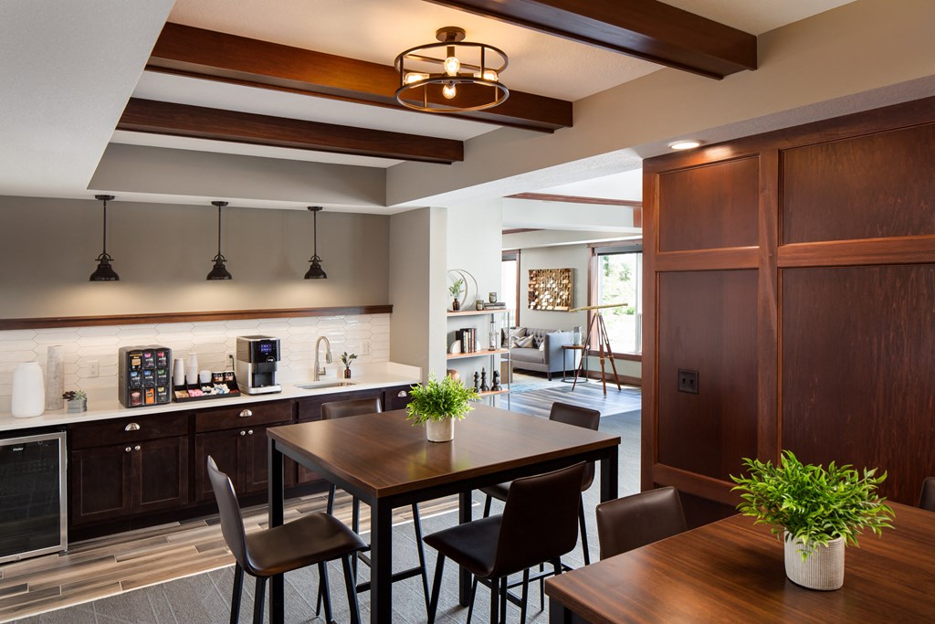 a view of the community room with a coffee bar  at Victoria Park and V2 Apartments, St. Paul