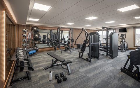 Fitness center with strength training equipment at The Murphy Apartments, Savage, 55372