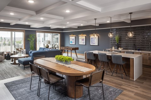 Clubhouse with kitchen bar and community seating at The Murphy Apartments, Savage, MN