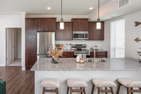 a kitchen with a marble counter top and