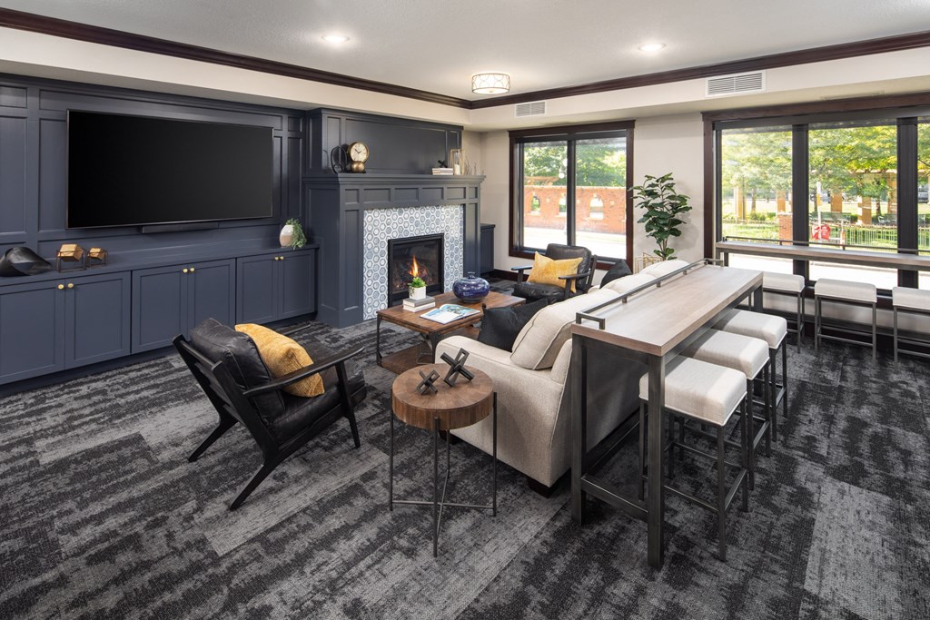 Clubhouse interior with lounger area and fireplace at The Whitley in St. Paul, MN.