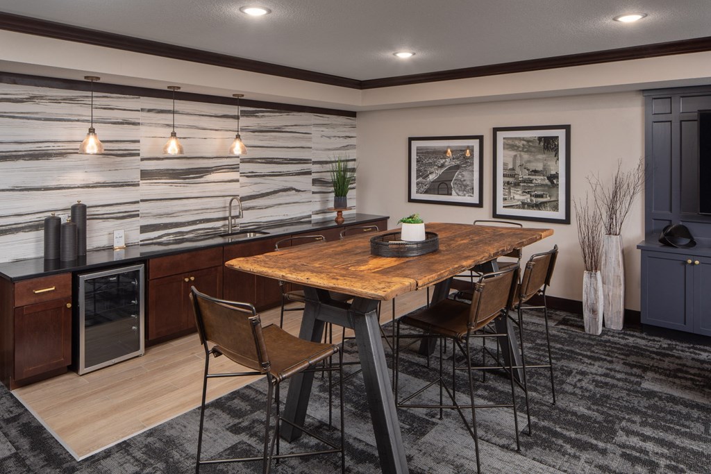 Lounge area with tables, chairs, and breakfast nook  at The Whitley, St. Paul, 55101