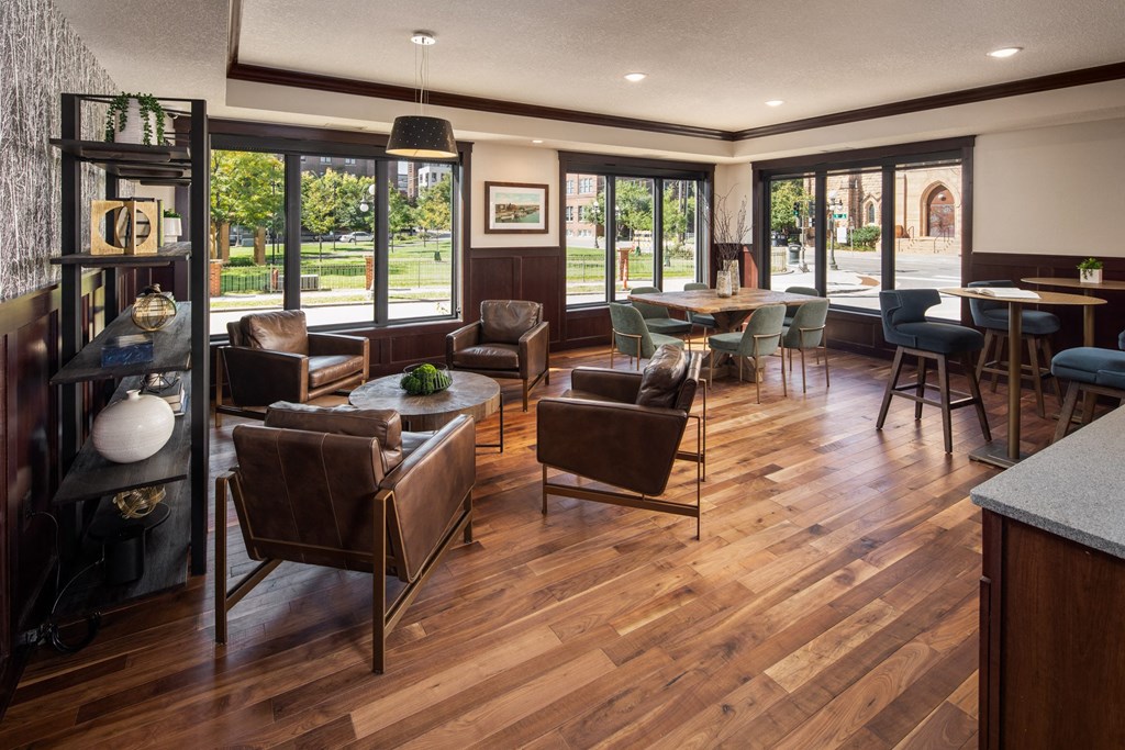 View of coffee lounge with tables and chairs  at The Whitley, St. Paul, Minnesota