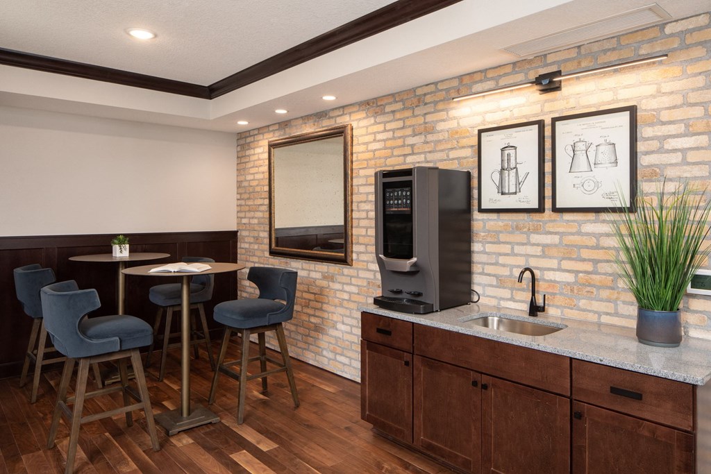 Lounge area with tables, chairs, and breakfast nook  at The Whitley, St. Paul, MN