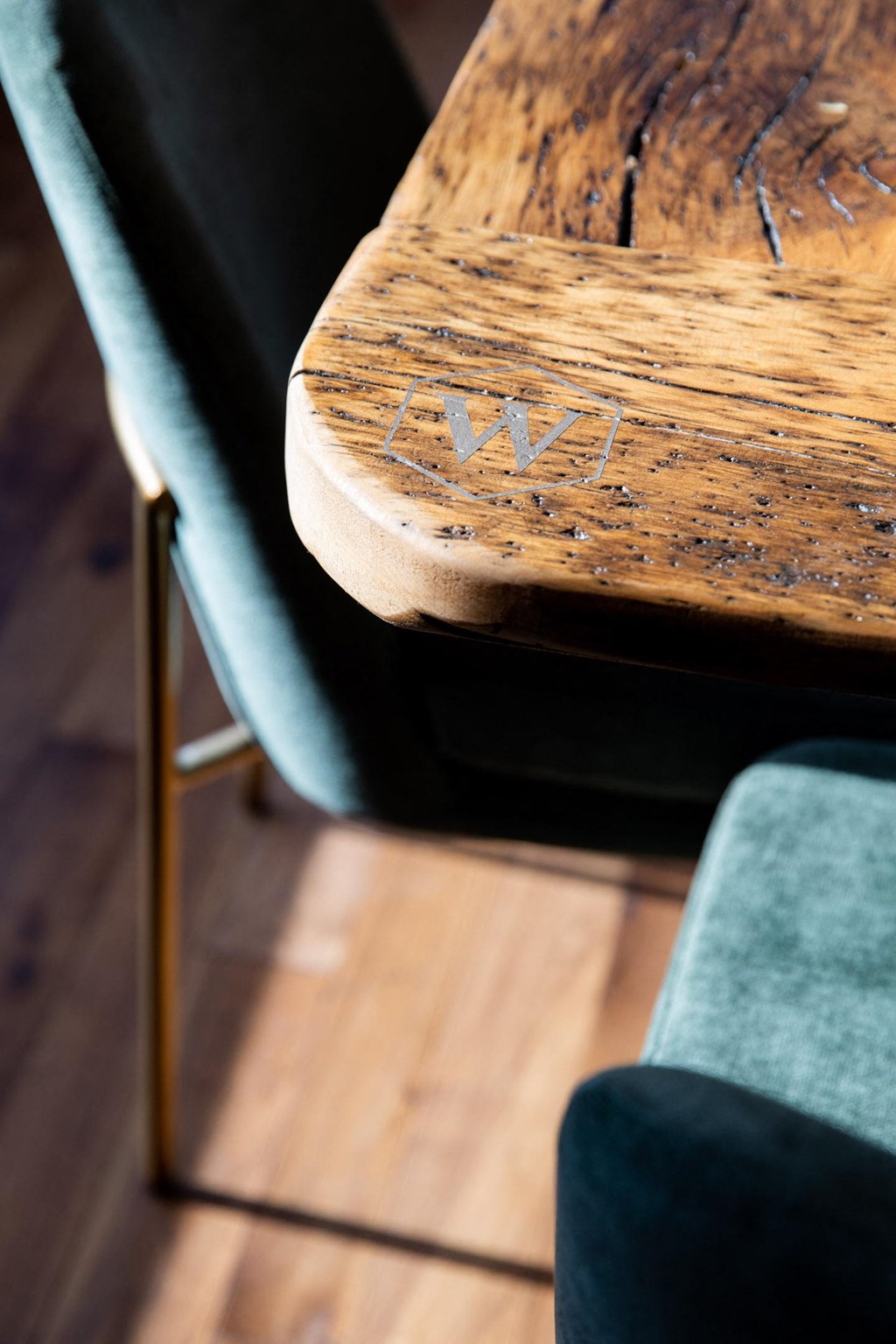 Custom table engraved with The Whitley logo. at The Whitley, St. Paul, MN