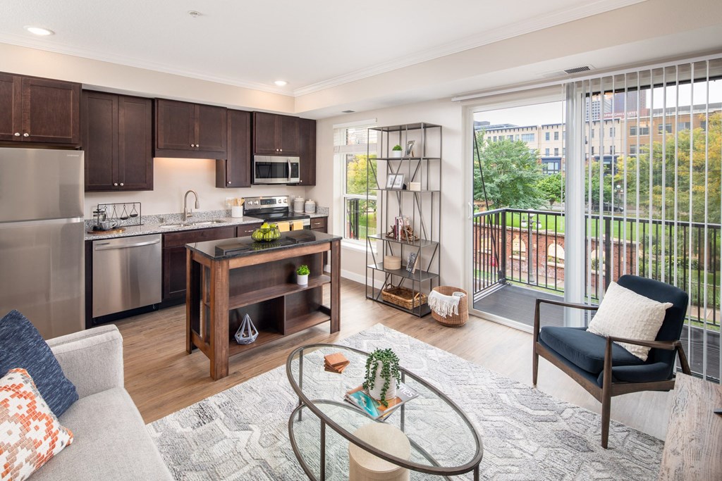View of modern living room and kitchen area  at The Whitley, St. Paul