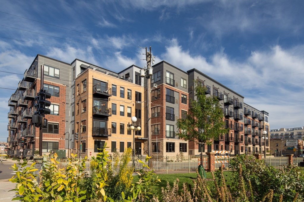 Full outdoor exterior view of The Whitley apartment building in St. Paul, MN.
