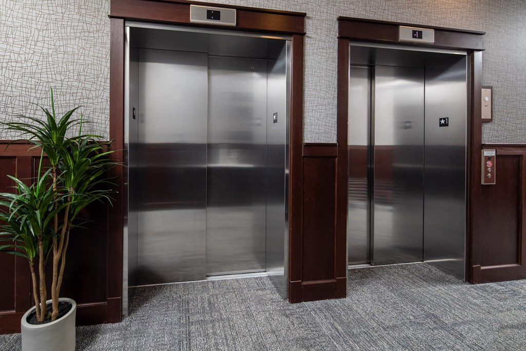 a row of elevators in an apartment building at The Gallery Apartments, Burnsville, Minnesota