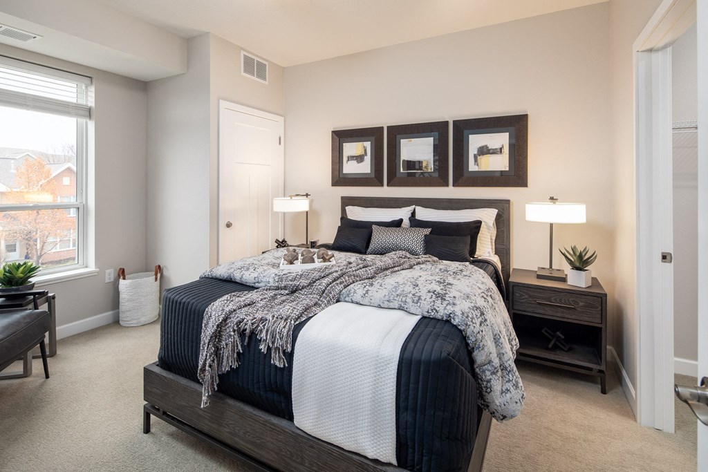 a bedroom with a large bed at The Gallery Apartments, Burnsville