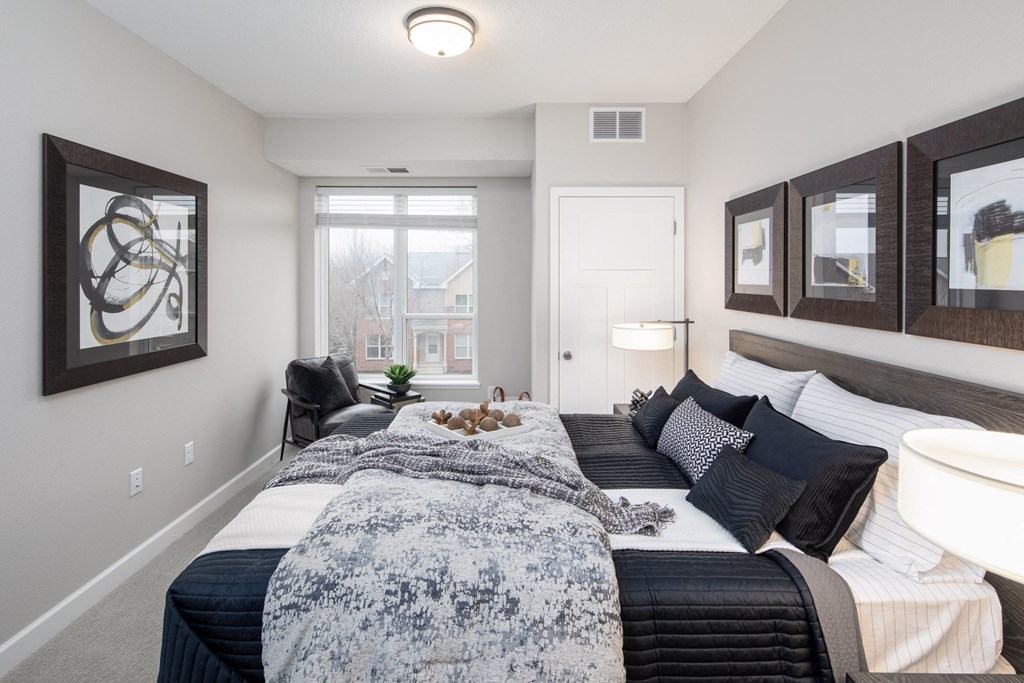a bedroom with a large bed at The Gallery Apartments, Minnesota