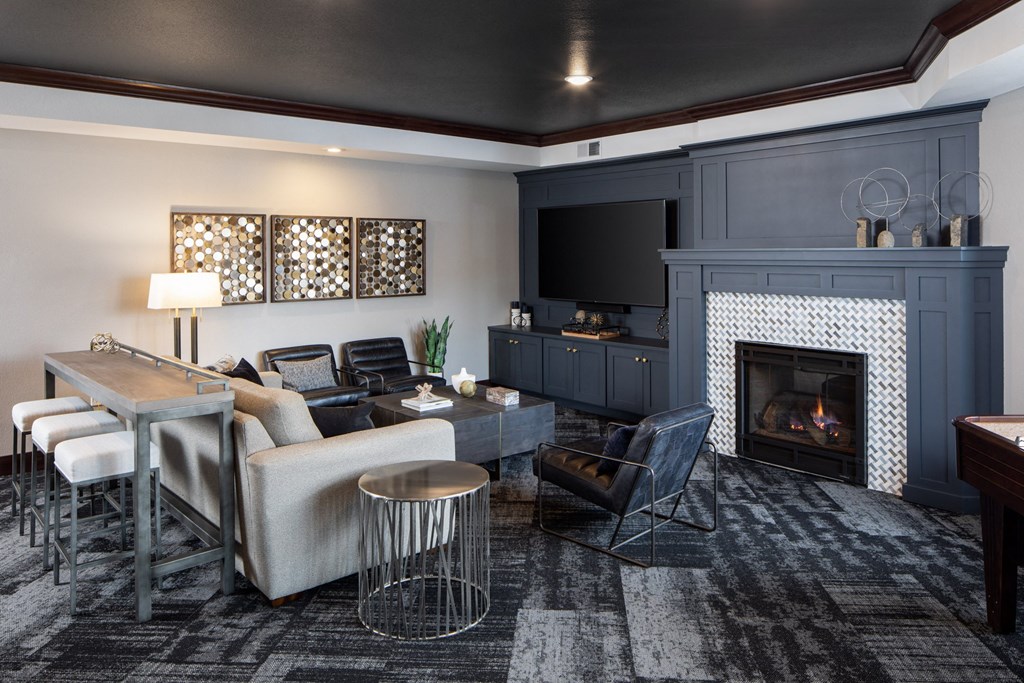 a living room filled with furniture and a fire place at The Gallery Apartments, Burnsville, MN, 55337