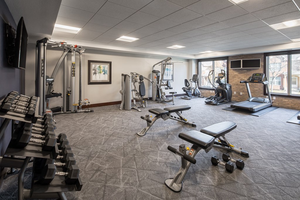 a large fitness room with treadmills and other exercise equipment at The Gallery Apartments, Burnsville, 55337