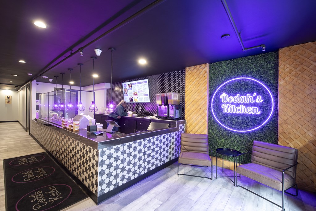 a restaurant with a counter and a neon sign on the wall at Queen Anne Belvedere, Baltimore, 21201