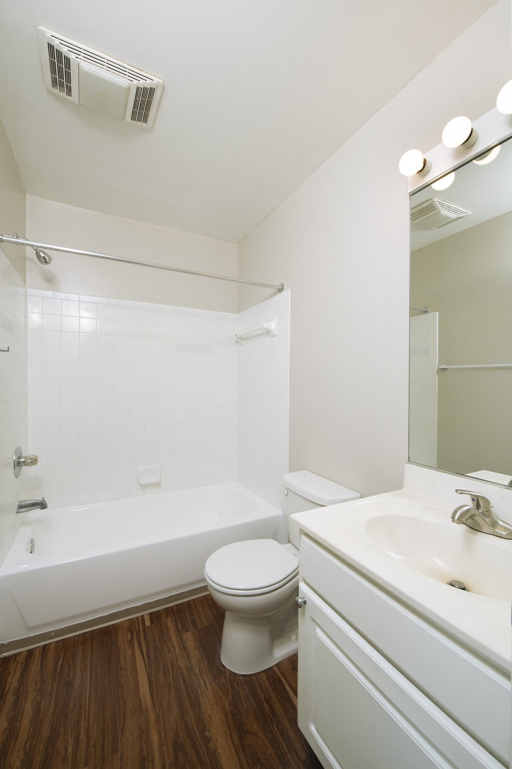 a bathroom with a toilet and a tub and a sink at Queen Anne Belvedere, Baltimore, MD 21201