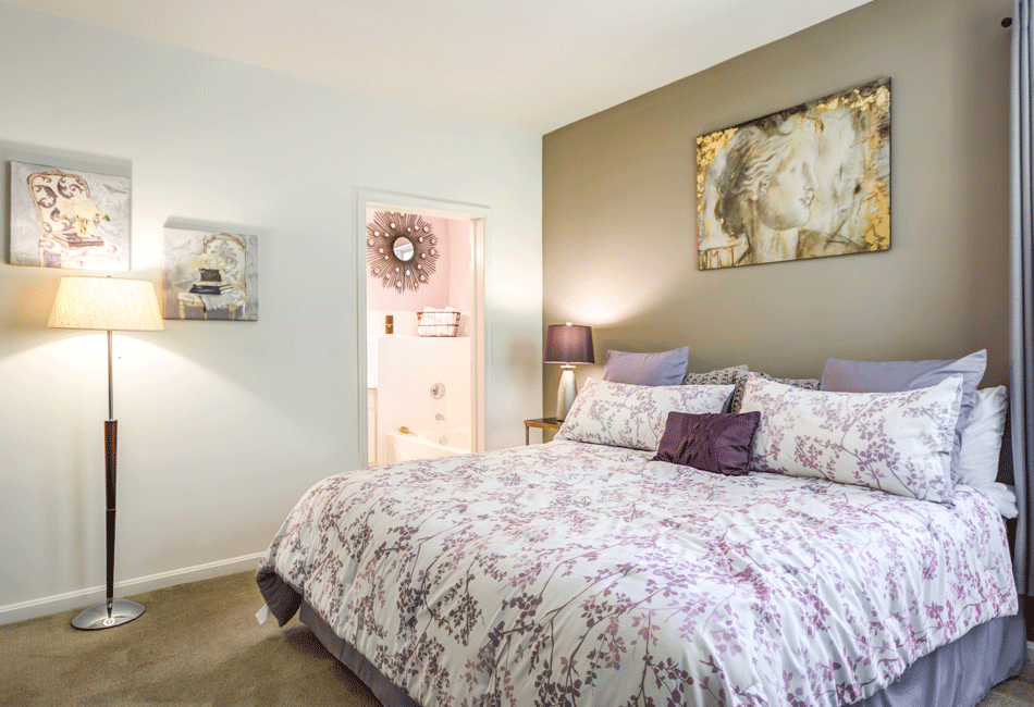 Bedroom With Night Lamp at Vivant Woodholme, Maryland