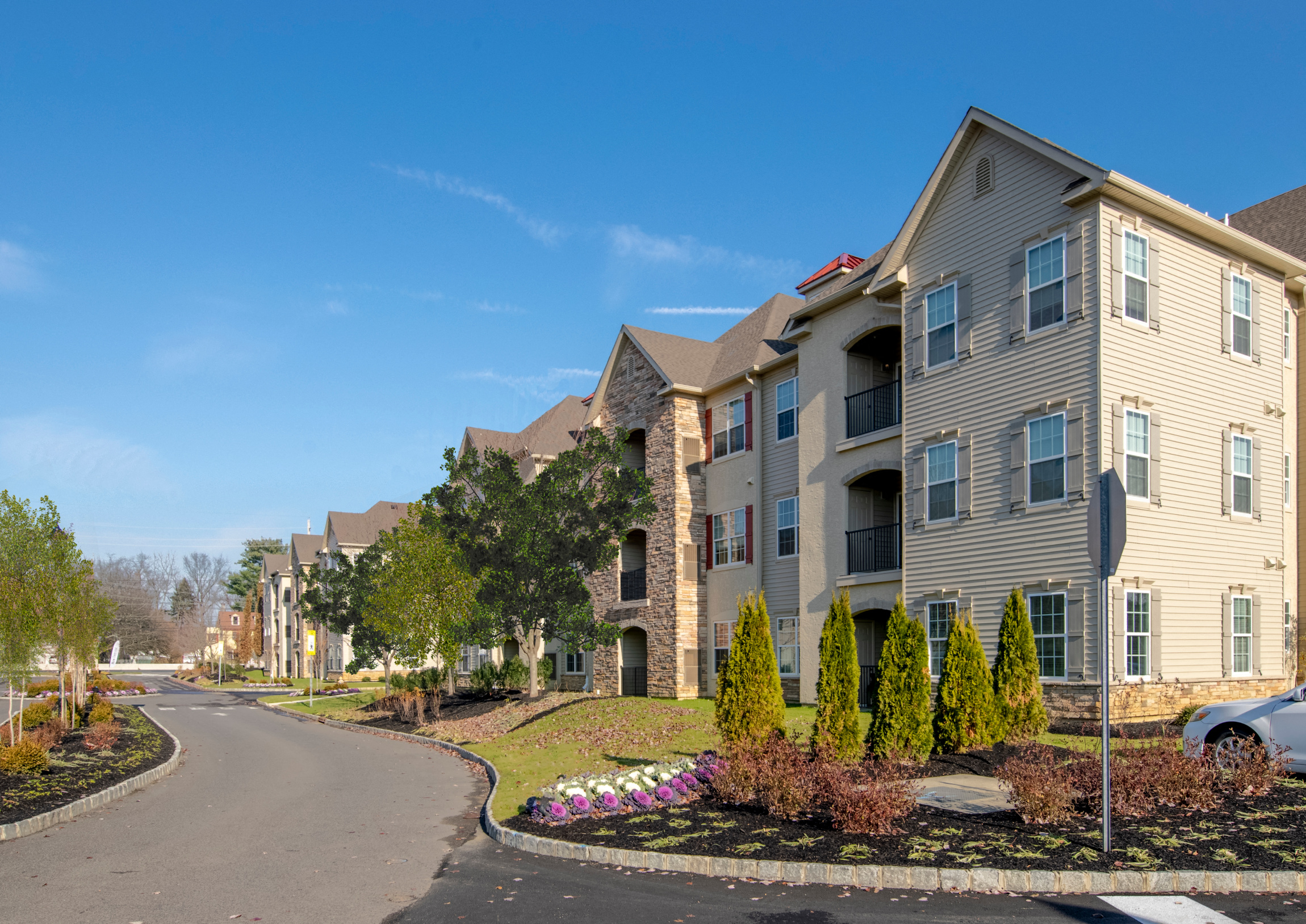 an apartment building on the corner of a street