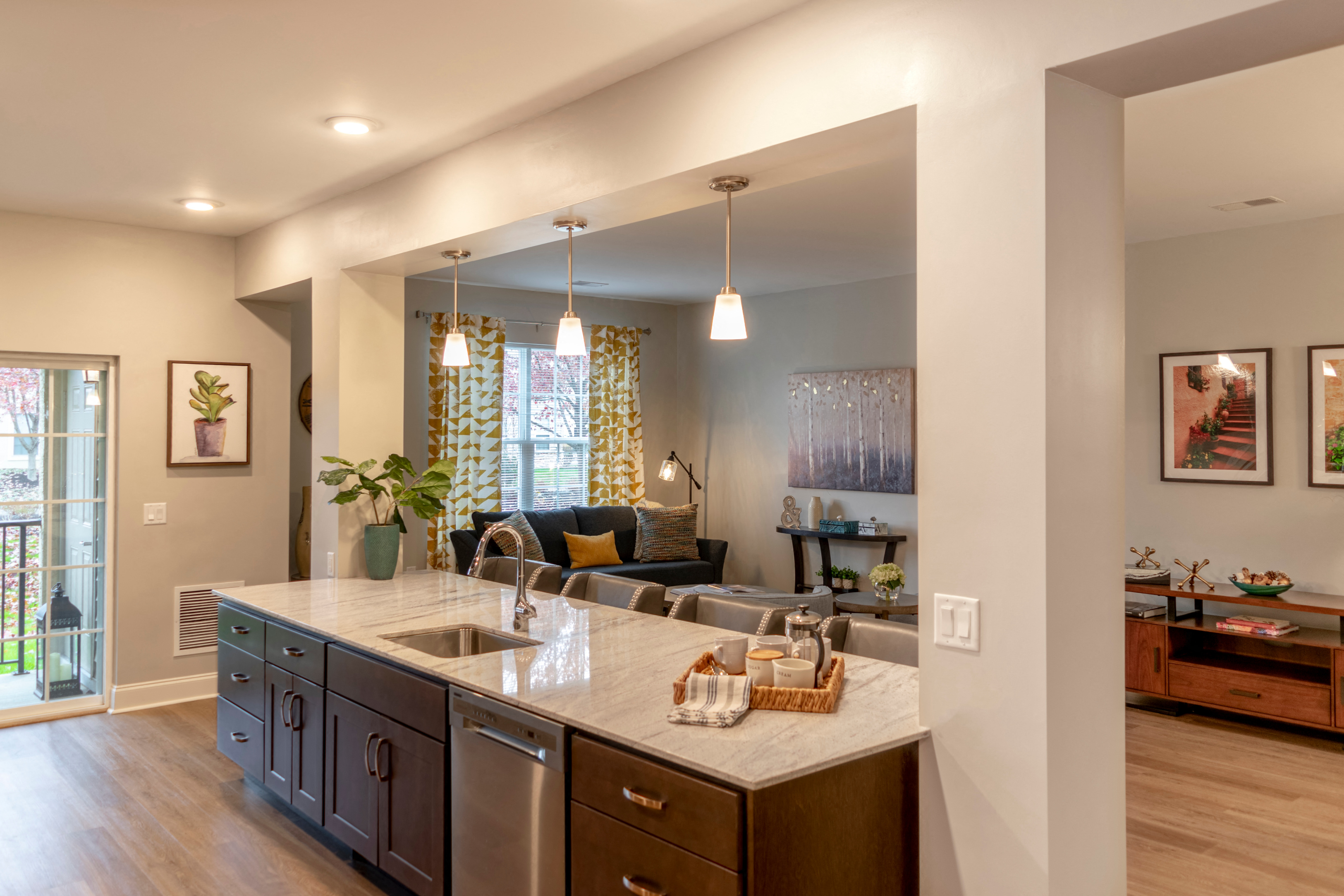 the view from the kitchen into the living room of a new home