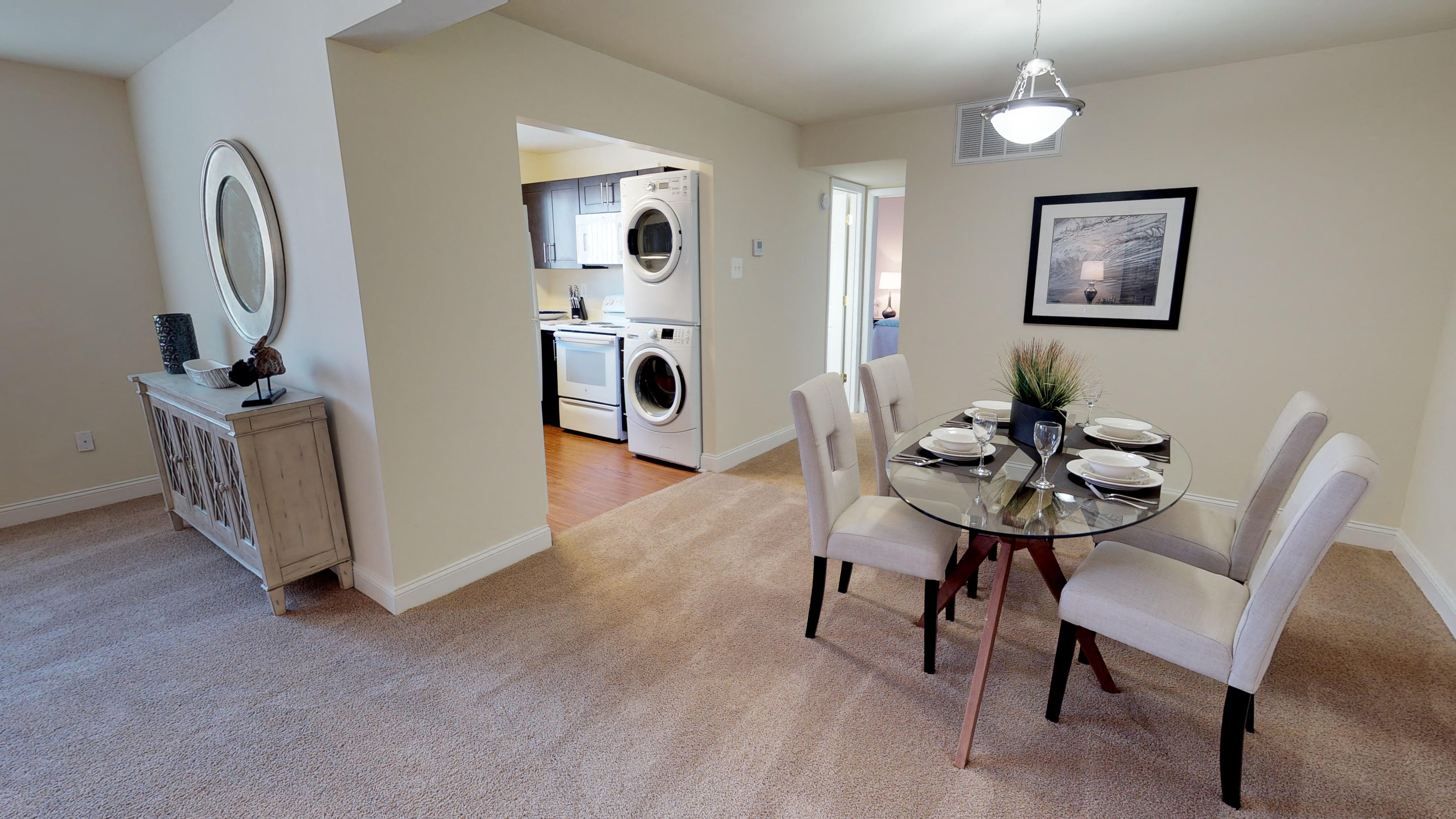 a living room with blue couches and a table