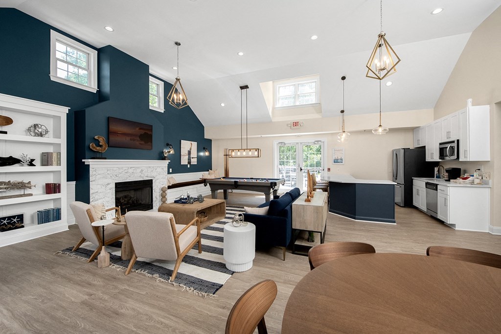 A modern kitchen with a dining table and chairs. at Spa Cove Apartments, Annapolis, 21403