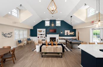 a large living room with a pool table and a dining room at Spa Cove Apartments, Annapolis, 21403