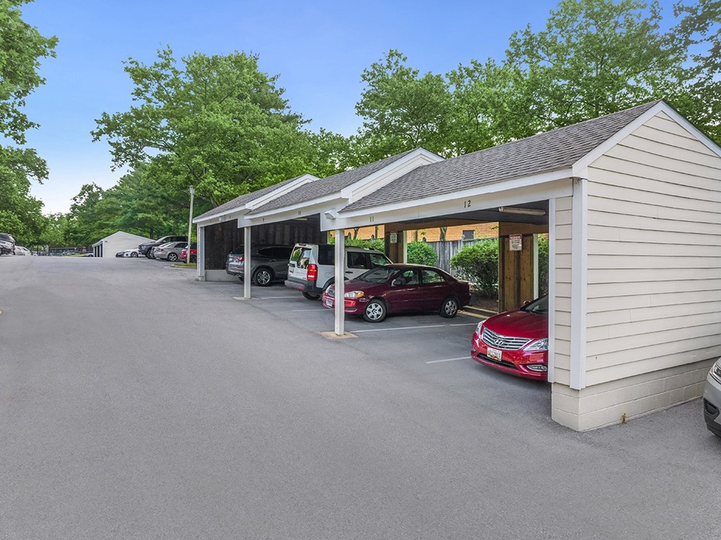 A parking lot with a building and cars parked in front. at West Woods, Annapolis, Maryland