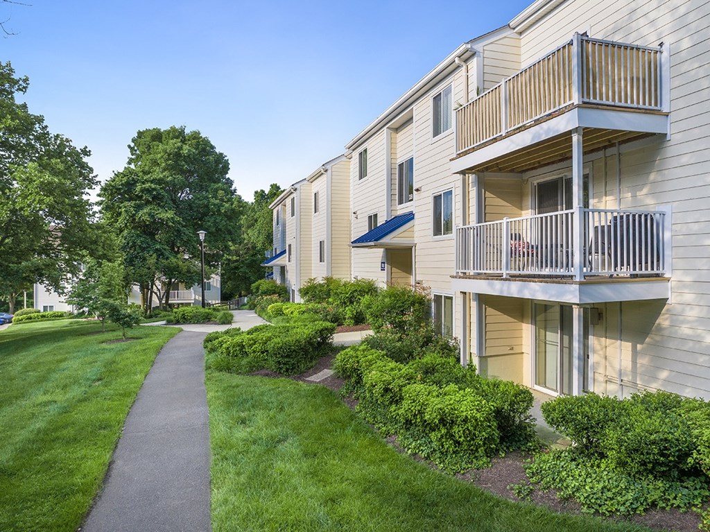 A building with a balcony and a walkway in front of it. at West Woods, Annapolis