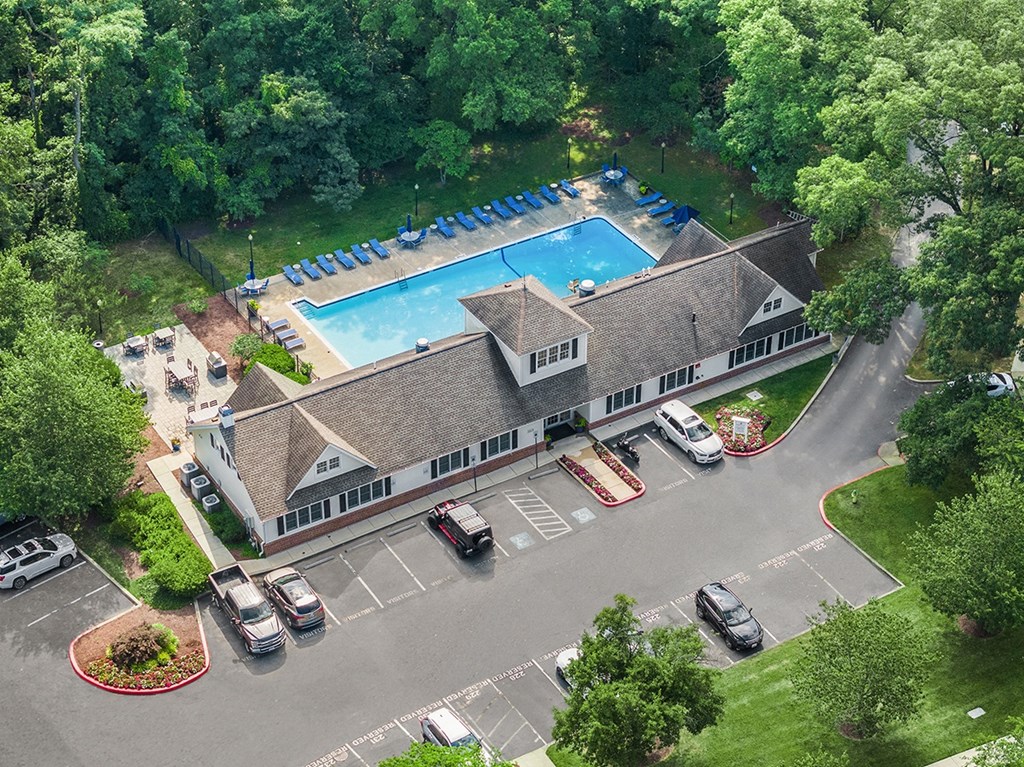 A large building with a pool in front of it. at Spa Cove Apartments, Annapolis, 21403