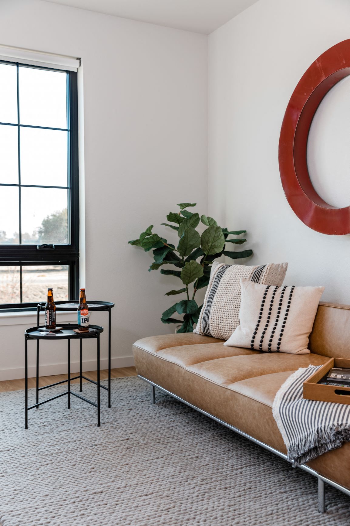 a living room with a couch and a table and a window
