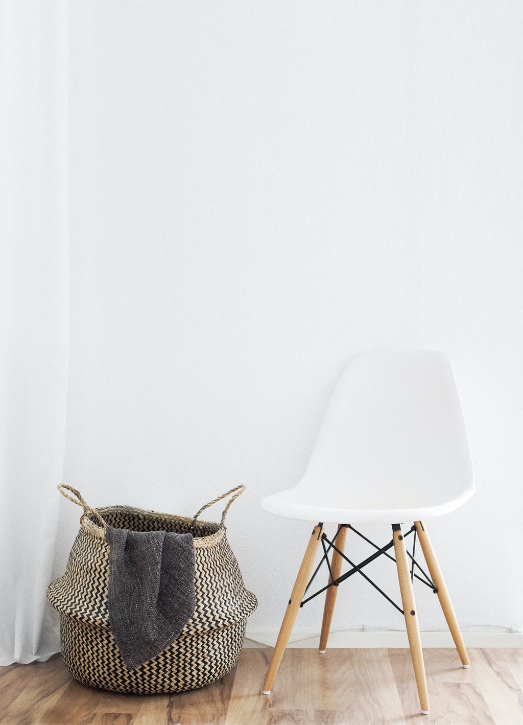a basket and a white chair in a room