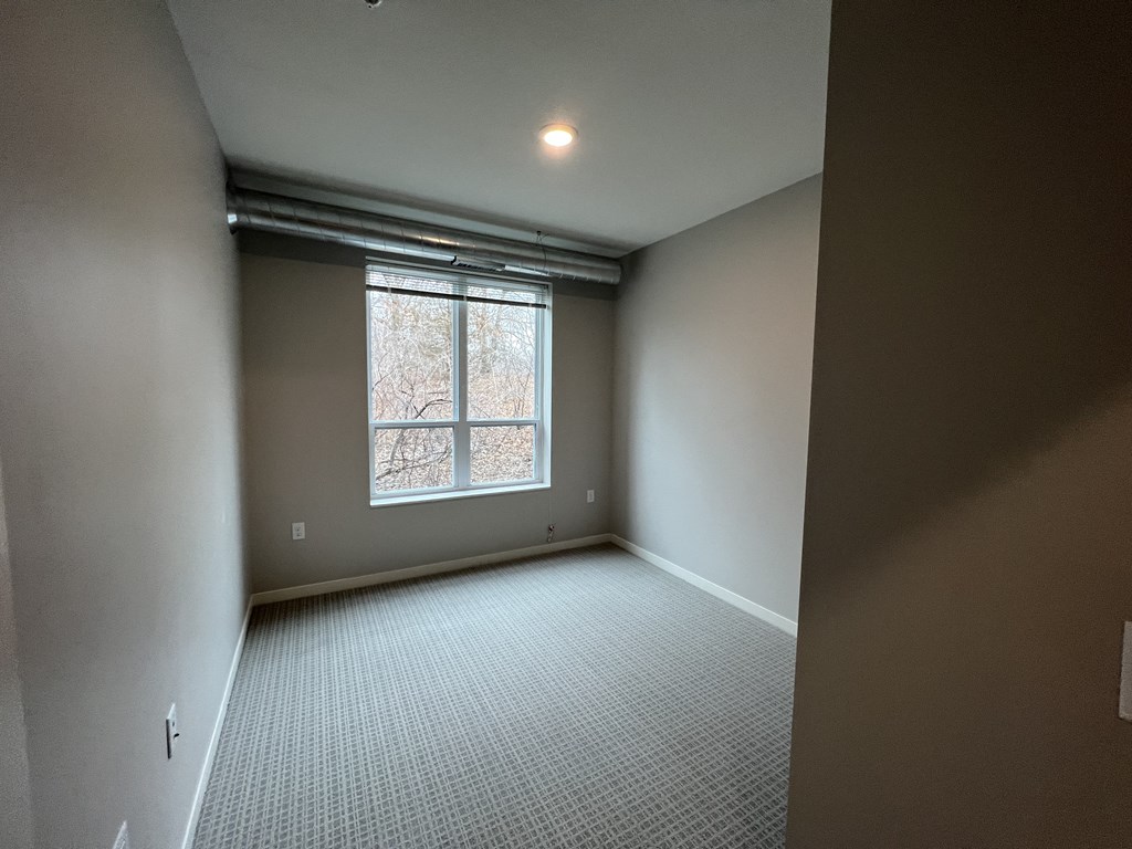 an empty room with a window in it