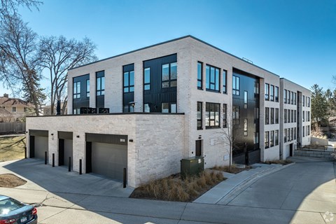 A modern building with a mix of white and black exterior.