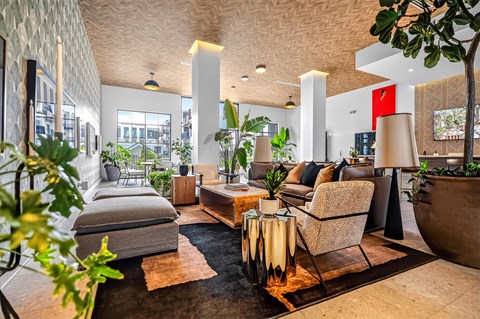 A living room with a grey sofa and a wooden coffee table.