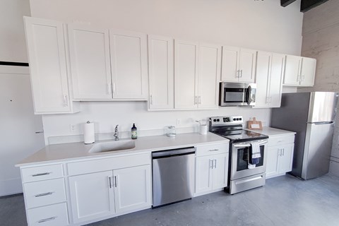 Kitchen with white cabinets and stainless steel appliances