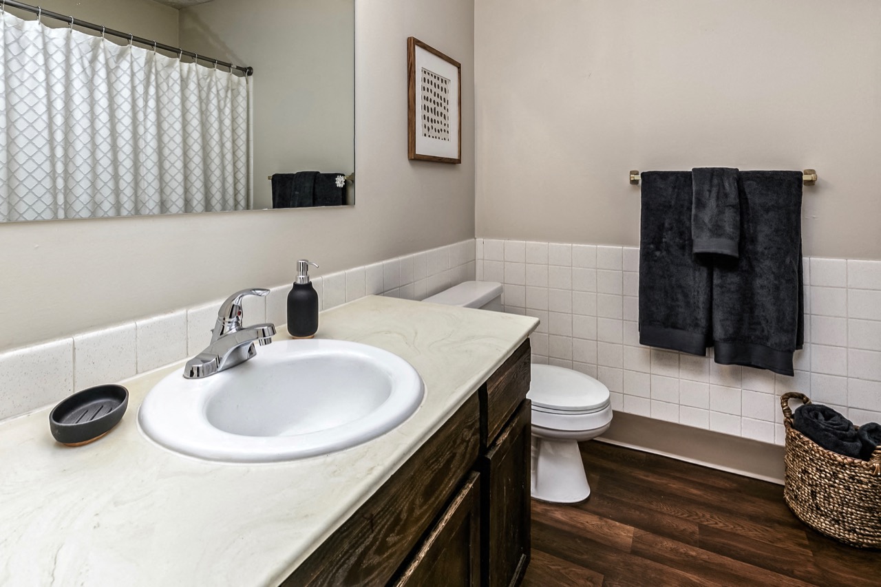 Bathrooms with large vanities at Club at Highland Park Apartments, Omaha, NE