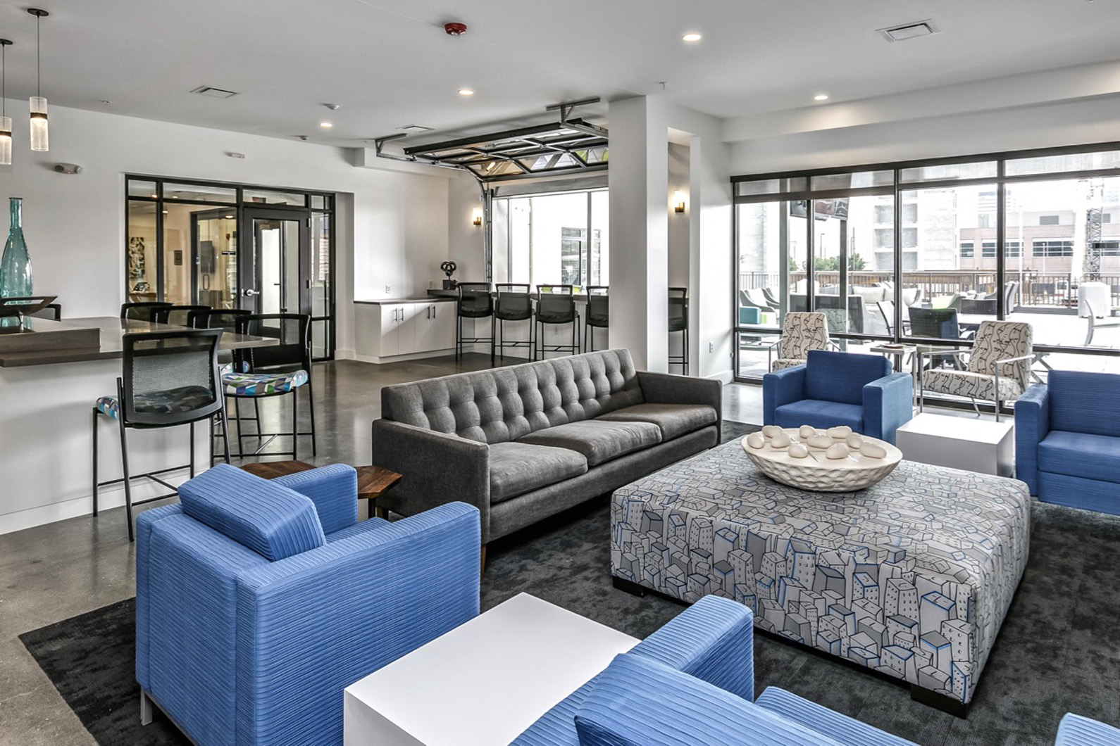 a living room with couches and chairs and a table