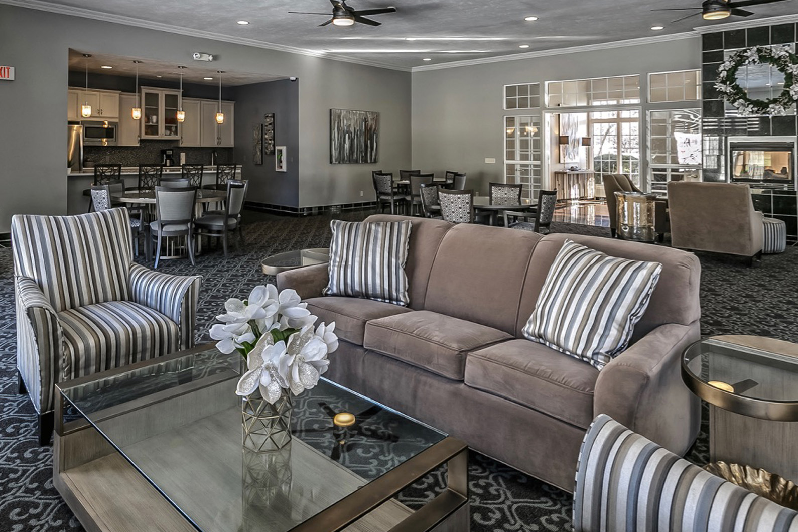 a living room with a couch and a glass table
