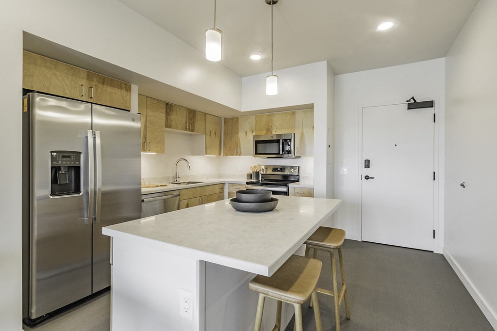 Studio, one and two bedroom apartment homes with stainless steel appliances, quartz countertops, backlit mirrors and large windows at 202 Railside in Springdale, AR Studio, one and two bedroom apartment homes with stainless steel appliances, quartz countertops, backlit mirrors and large windows at 202 Railside in Springdale, AR