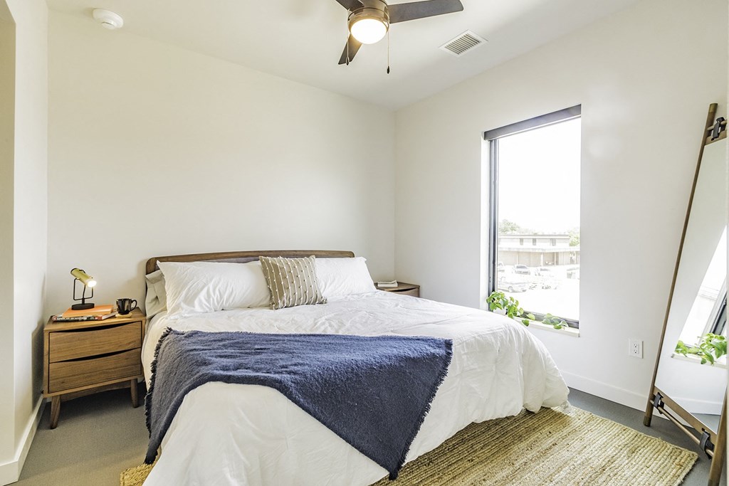 Studio, one and two bedroom apartment homes with stainless steel appliances, quartz countertops, backlit mirrors and large windows at 202 Railside in Springdale, AR