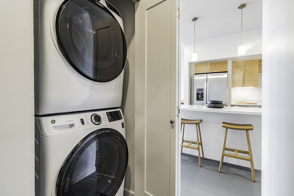 Studio, one and two bedroom apartment homes with stainless steel appliances, quartz countertops, backlit mirrors and large windows at 202 Railside in Springdale, AR