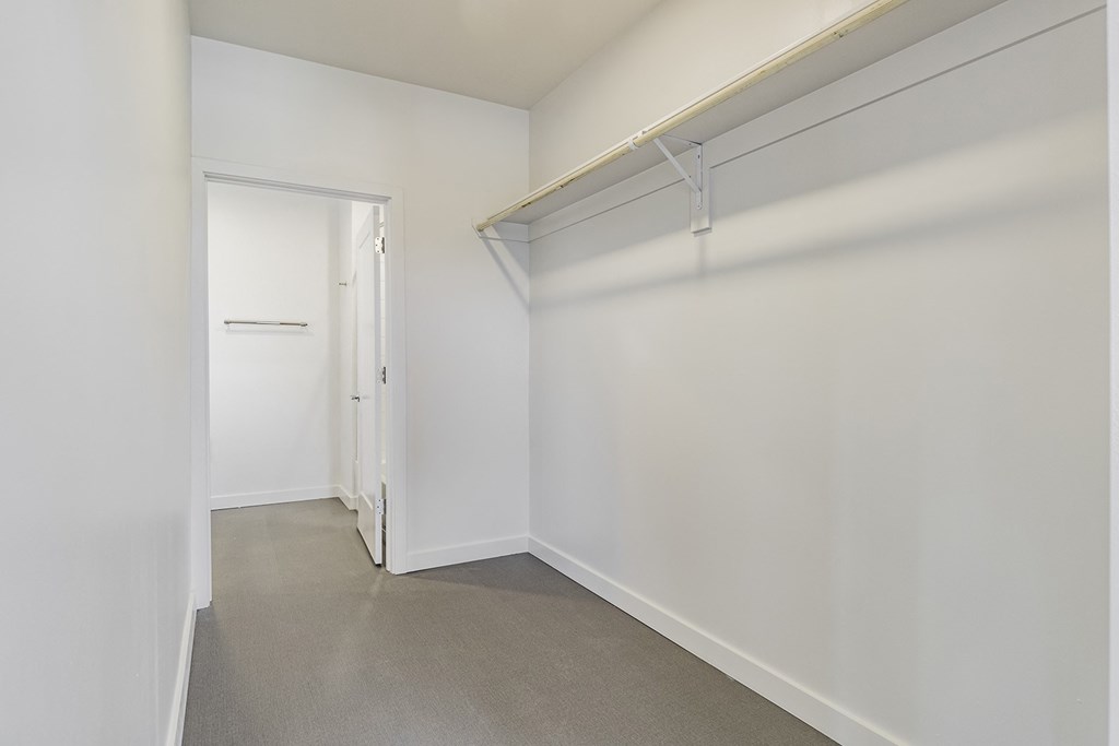 Studio, one and two bedroom apartment homes with stainless steel appliances, quartz countertops, backlit mirrors and large windows at 202 Railside in Springdale, AR