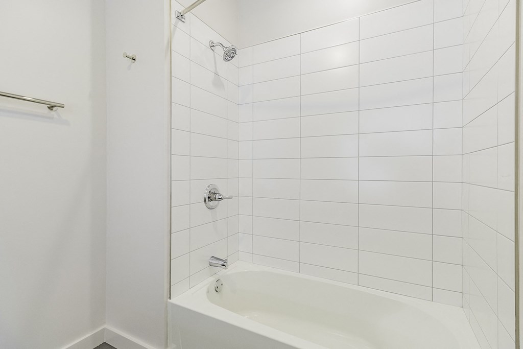 Studio, one and two bedroom apartment homes with stainless steel appliances, quartz countertops, backlit mirrors and large windows at 202 Railside in Springdale, AR