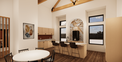 A modern kitchen with a table and chairs.