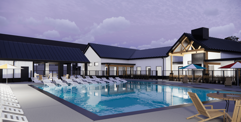 A large outdoor swimming pool with lounge chairs and umbrellas.