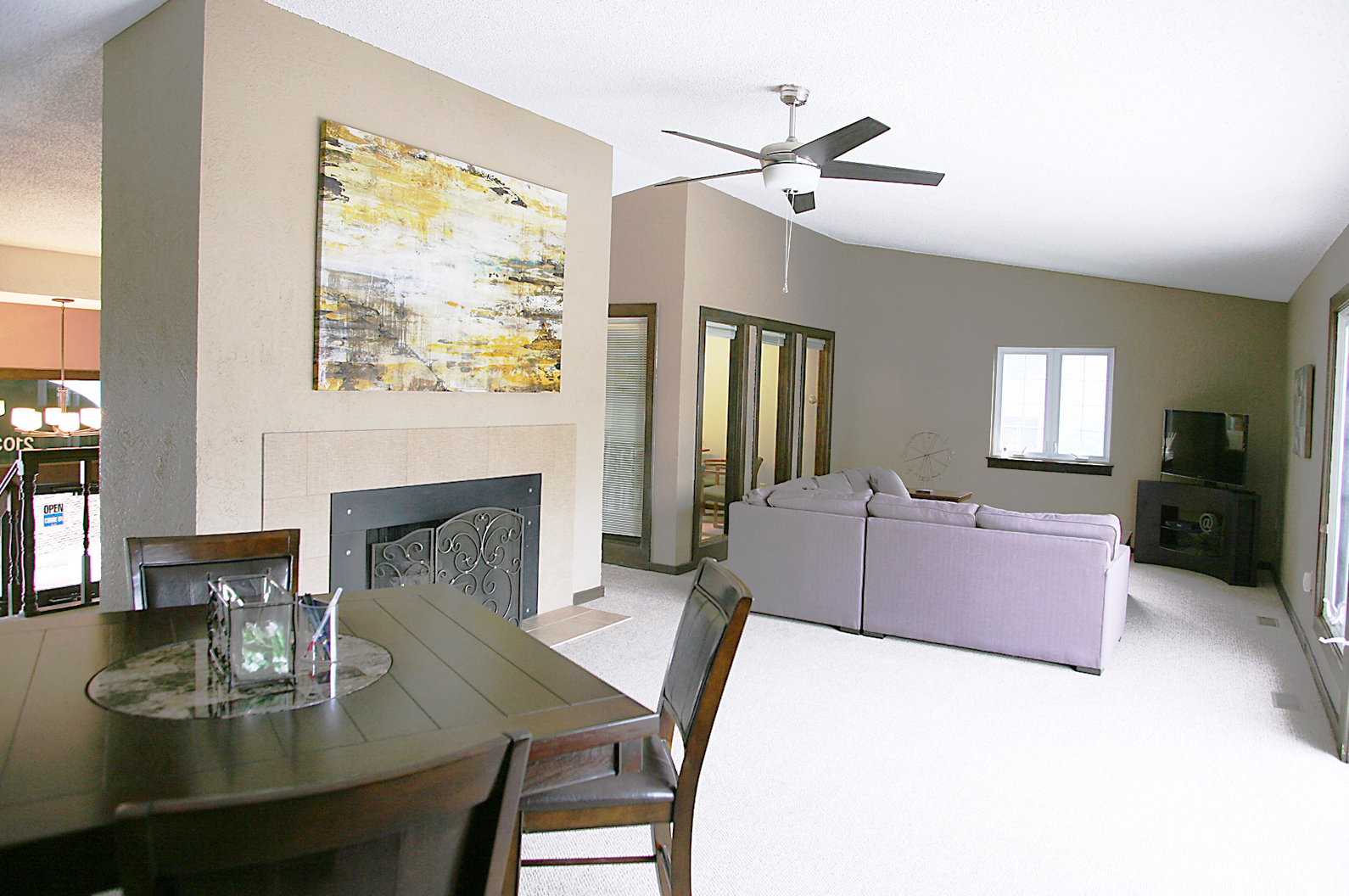 a living room with a table and a couch