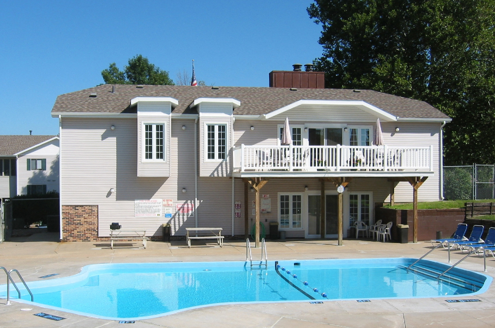 a house with a swimming pool in front of it