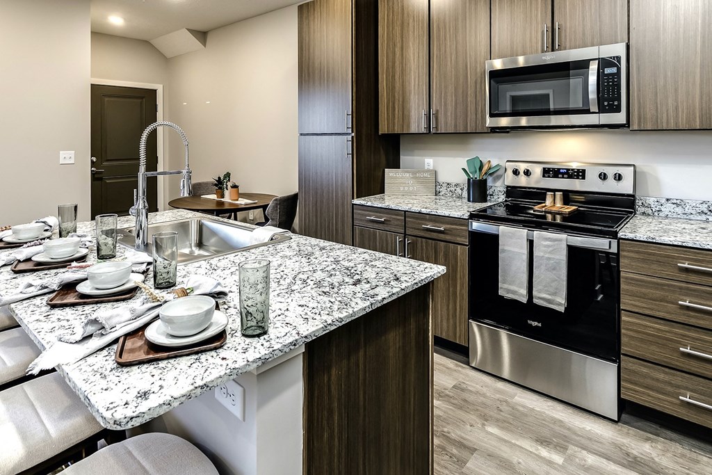Studio, 1, 2 and villa-style homes featuring stainless steel appliances, granite coutertops, plank flooring, and many other amazing amenities at The 8801 in Lincoln, NE.
