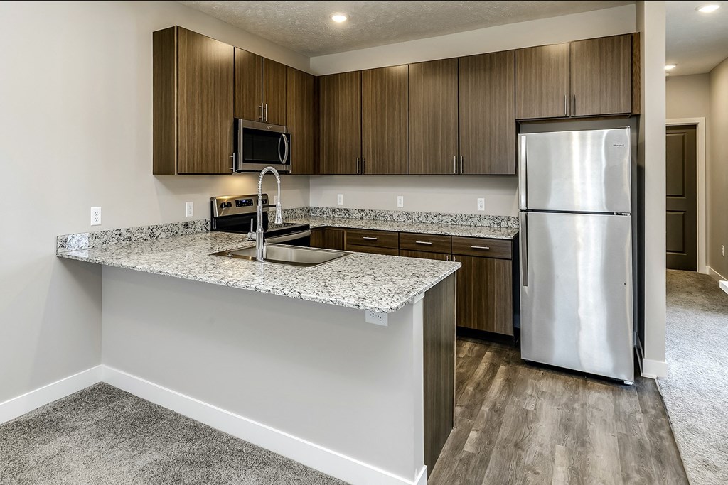 Studio, 1, 2 and villa-style homes featuring stainless steel appliances, granite coutertops, plank flooring, and many other amazing amenities at The 8801 in Lincoln, NE.
